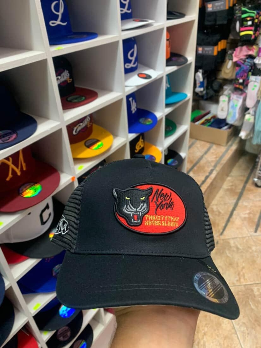 Black Trucker Hat with Panther Patch - New York Text